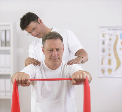 Photo of a guy doing physical therapy with a theraband
