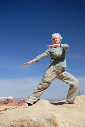 Lady balancing on rocks